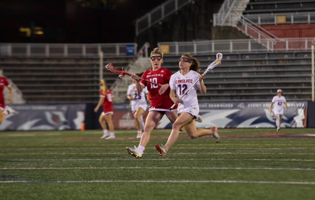Midfielder Ellie Masera runs past Rutgers defender Jessica Beneducci on Tuesday, April 9. During Sundays win against Drexel, Masera set a single-game career-high with 12 points. BRITTNEY DIETZ/THE STATESMAN