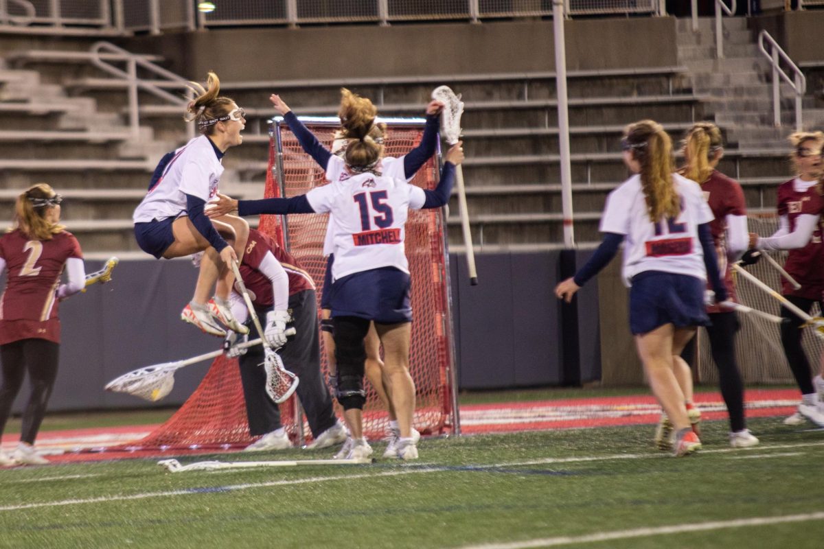 The Stony Brook womens lacrosse team celebrates a goal against Elon on Friday, March 22. The Seawolves will be back at Kenneth P. LaValle Stadium on Saturday to battle Delaware. ANGELINA LIVIGNI/THE STATESMAN
