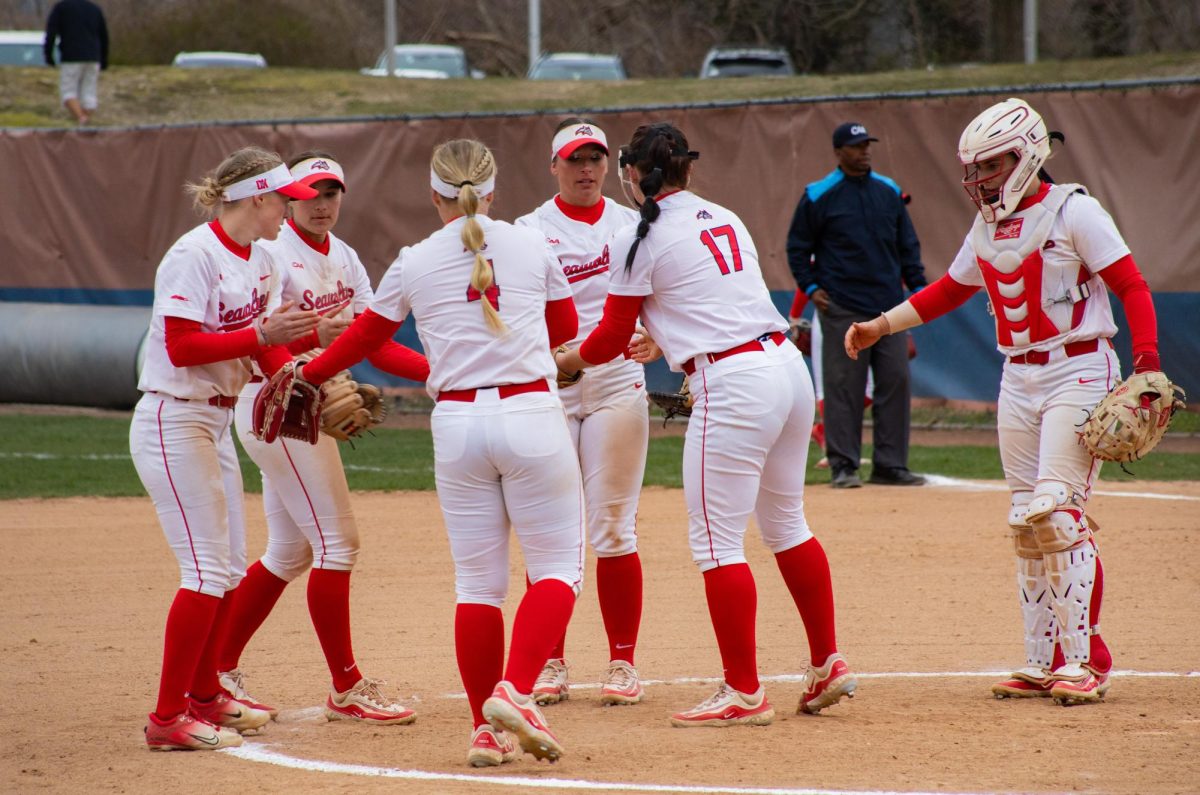 Members from the Stony Brook softball team celebrate an out against Delaware on Friday, March 22. The Seawolves will butt heads with the Blue Hens in the second round of the 2024 CAA softball tournament on Thursday. BRITTNEY DIETZ/THE STATESMAN