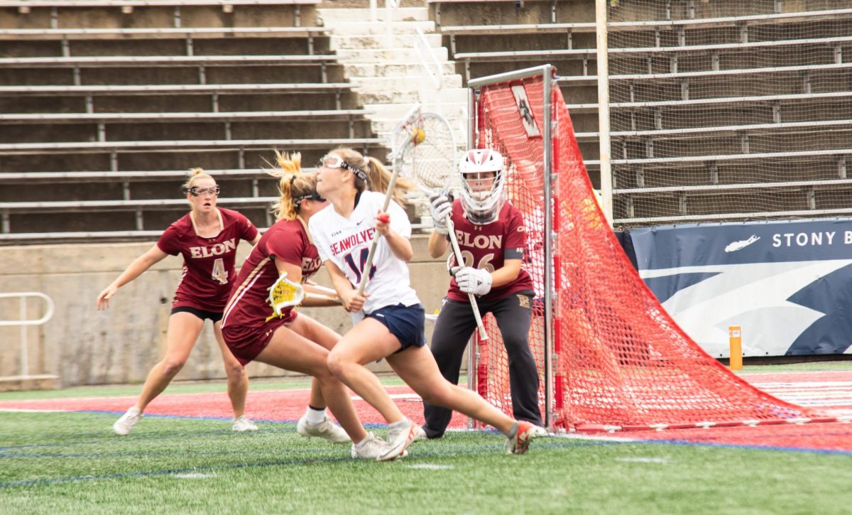 Attacker Kailyn Hart drives the net against Elon on Thursday, May 2. Hart recorded a single-game career-high eight points and netted a single-game career-high-tying seven goals to lead the Stony Brook womens lacrosse team to the 2024 CAA Championship game. IRENE YIMMONGKOL/THE STATESMAN