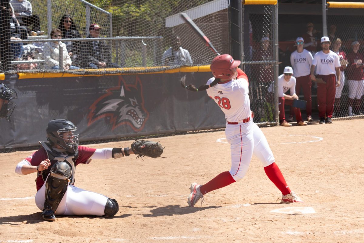 First baseman Corinne Badger follows through on a swing against Elon on Friday, April 26. Badger blasted a home run and utilized nifty footwork to prevent a run in the Stony Brook softball teams 3-0 win over Hofstra on Wednesday. ANGELINA LIVIGNI/THE STATESMAN